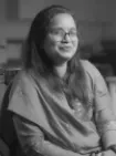 Portrait of Nidhi, an employee at Square Corporation, highlighting the supportive company culture in her written testimonial.